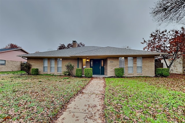 ranch-style home with a front yard