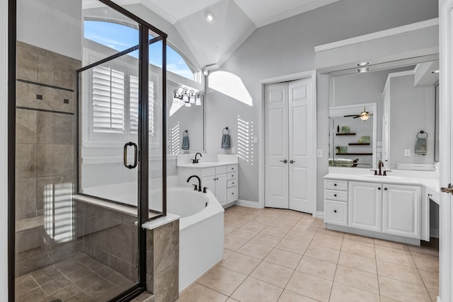 bathroom with independent shower and bath, vanity, lofted ceiling, and tile patterned flooring