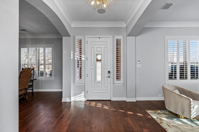 entryway featuring crown molding and dark hardwood / wood-style flooring