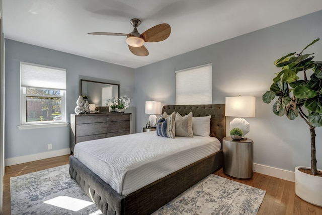 bedroom featuring ceiling fan and light hardwood / wood-style flooring