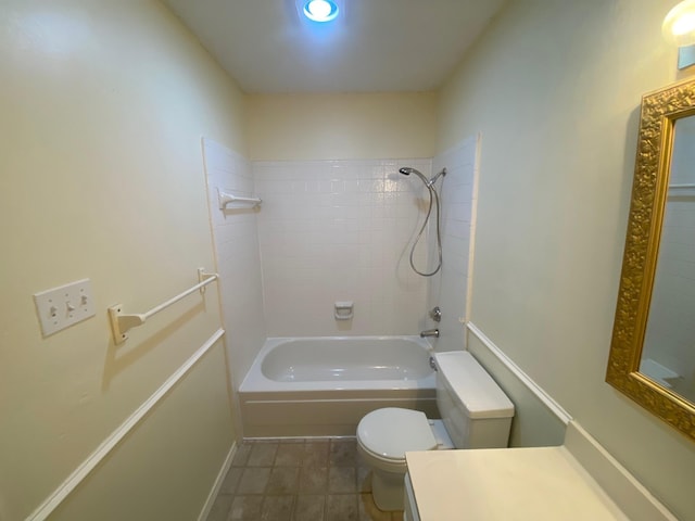 full bathroom featuring vanity, toilet, and tiled shower / bath