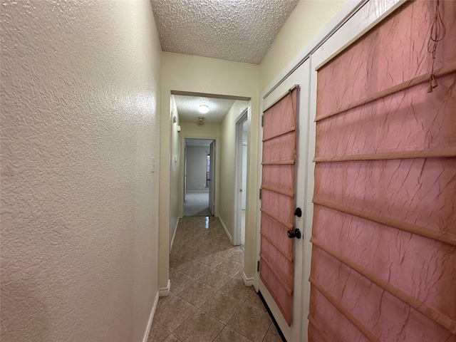 corridor with a textured ceiling