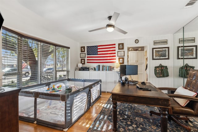 office space with light wood-type flooring and ceiling fan