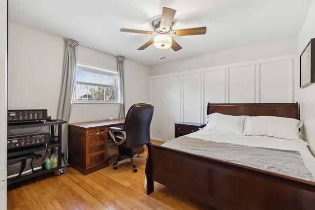 bedroom with light wood-type flooring and ceiling fan