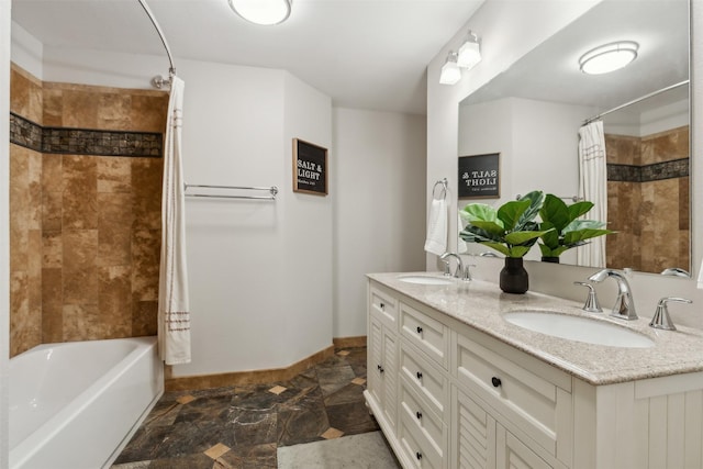 bathroom featuring shower / bath combo with shower curtain and vanity