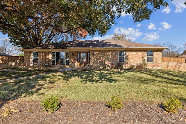 back of property with a patio and a yard