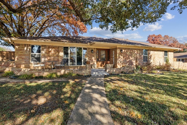 ranch-style house with a front lawn