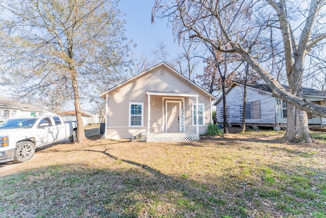 bungalow with a front yard