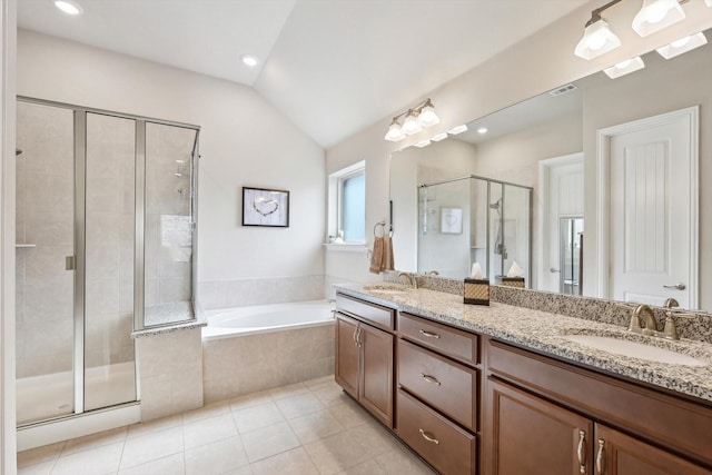 bathroom featuring tile patterned floors, vanity, lofted ceiling, and plus walk in shower