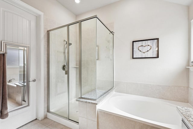 bathroom featuring tile patterned floors and plus walk in shower