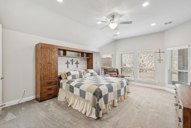 bedroom featuring ceiling fan, light carpet, and vaulted ceiling