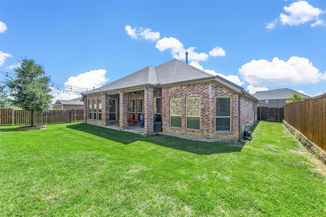 back of property featuring a patio area and a lawn