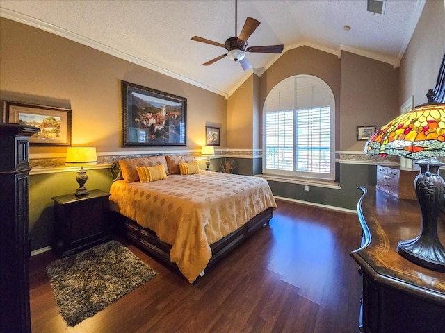 bedroom featuring crown molding, vaulted ceiling, ceiling fan, and dark hardwood / wood-style flooring