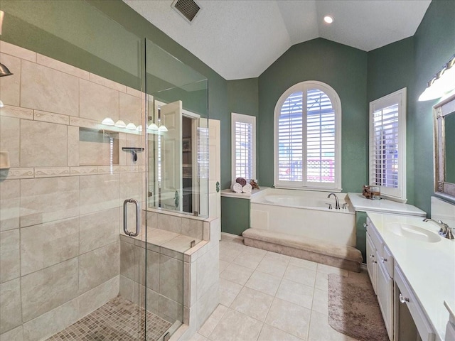 bathroom with vanity, shower with separate bathtub, tile patterned floors, and lofted ceiling