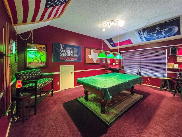 rec room with a textured ceiling, carpet, track lighting, lofted ceiling, and pool table