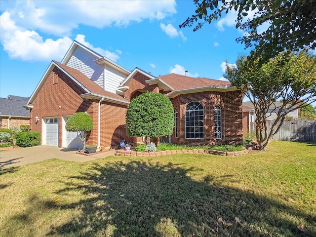 view of front property featuring a garage and a front yard