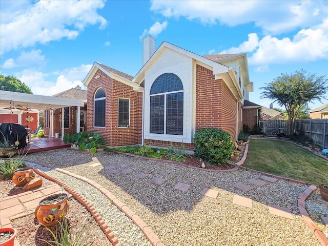 view of front of house with a patio and a front lawn