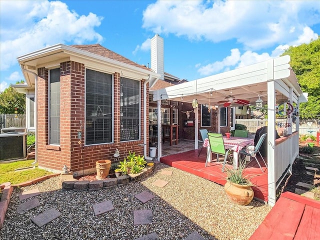 view of patio / terrace with a pergola, central AC, and a deck