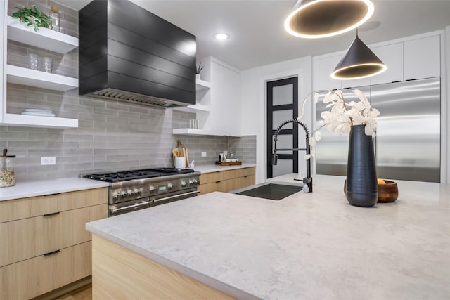 kitchen with custom range hood, decorative light fixtures, sink, backsplash, and double oven range