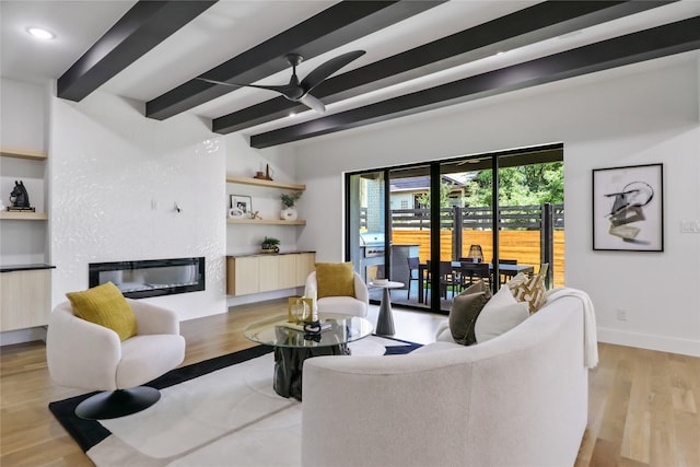 living room with light hardwood / wood-style flooring, beam ceiling, and ceiling fan