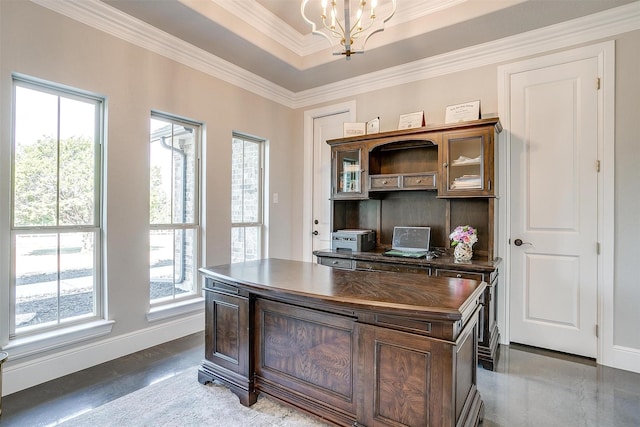 office space with a chandelier, ornamental molding, and a tray ceiling