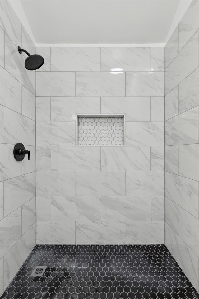 bathroom with tiled shower