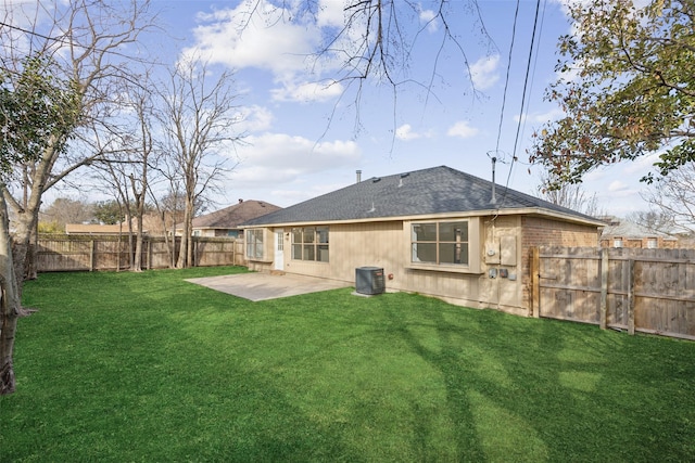 back of house featuring a patio area, a lawn, and central air condition unit