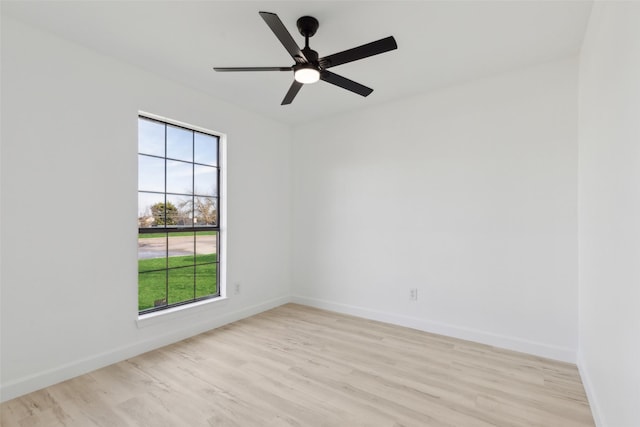 spare room with ceiling fan, light hardwood / wood-style floors, and plenty of natural light