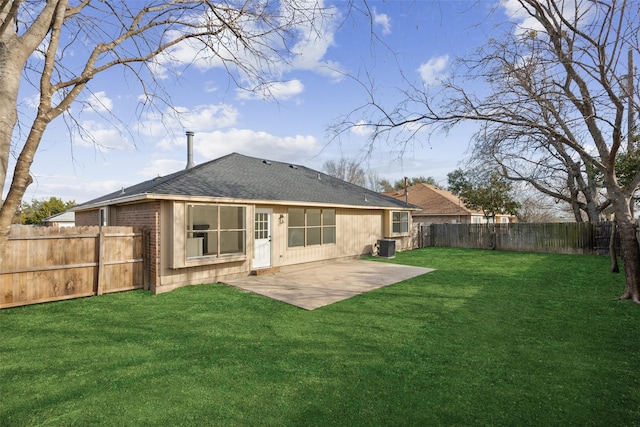 back of property featuring a lawn and a patio