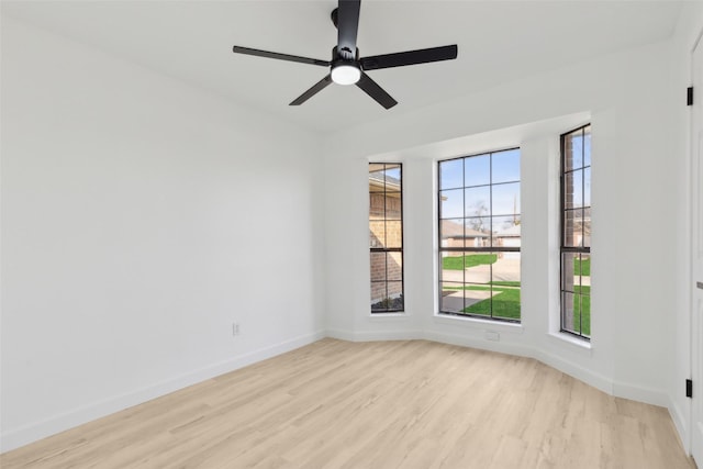 unfurnished room featuring light wood-type flooring and ceiling fan