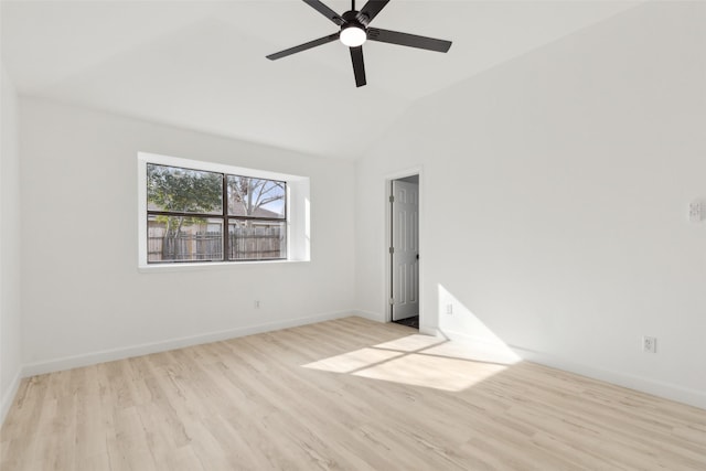 empty room featuring ceiling fan, light hardwood / wood-style floors, and lofted ceiling