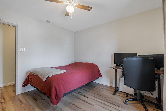 bedroom featuring light hardwood / wood-style flooring and ceiling fan