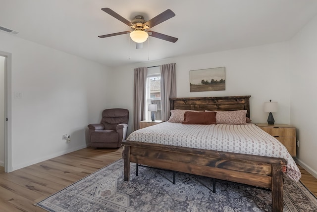 bedroom featuring ceiling fan and light hardwood / wood-style flooring