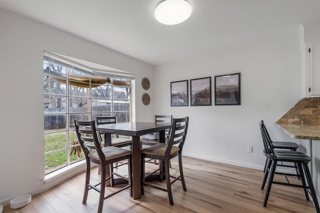 dining space featuring light hardwood / wood-style flooring