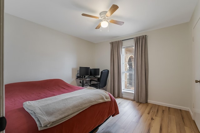 bedroom with ceiling fan and light hardwood / wood-style flooring