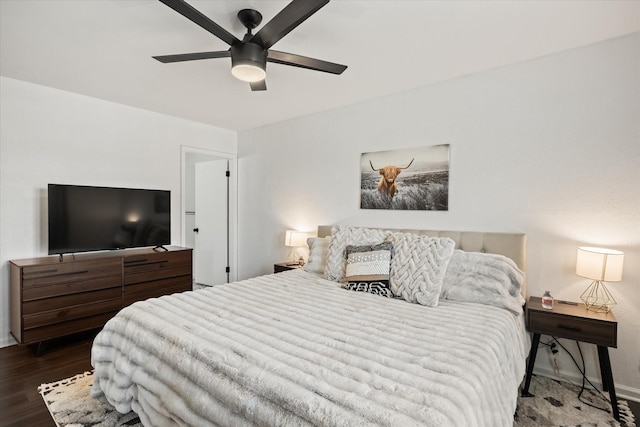 bedroom with baseboards, a ceiling fan, and wood finished floors