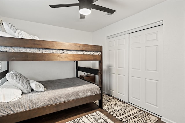 1201 S Rusk St, Weatherford, TX 76086 - bedroom featuring wood finished floors, ceiling fan, and a closet
