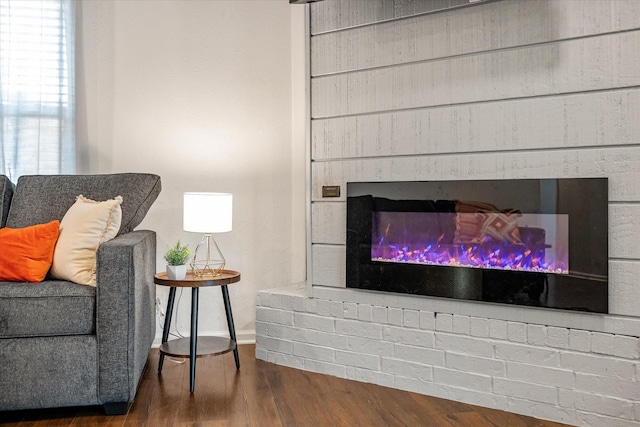 1201 S Rusk St, Weatherford, TX 76086 - sitting room with wood finished floors and a glass covered fireplace