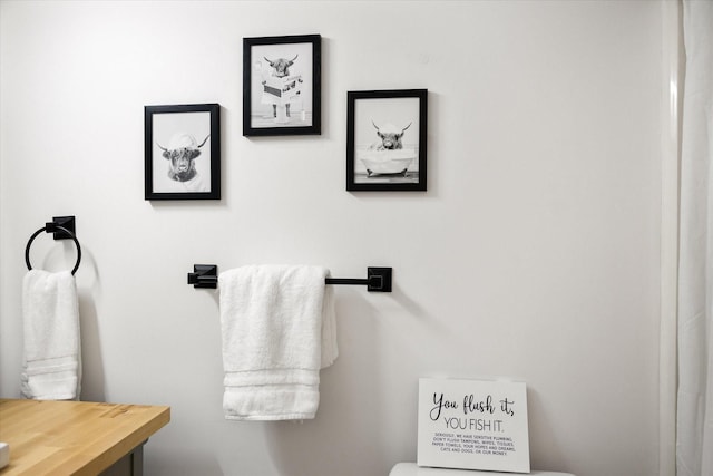 half bathroom featuring toilet and vanity