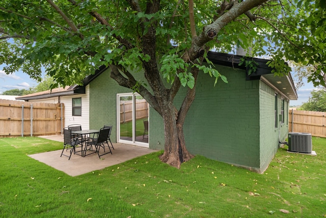 1201 S Rusk St, Weatherford, TX 76086 - back of house with brick siding, a patio area, and a fenced backyard