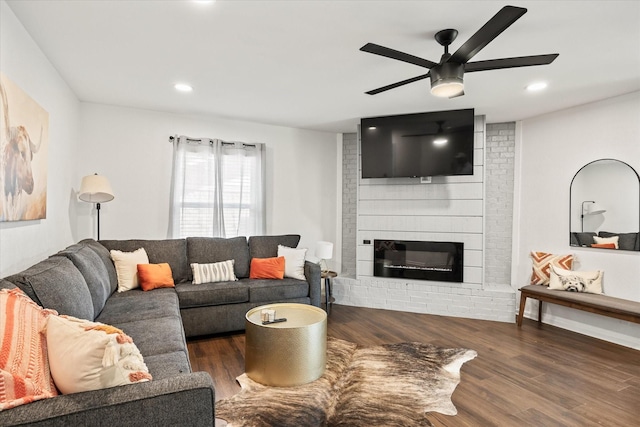 living area with ceiling fan, a fireplace, wood finished floors, and recessed lighting