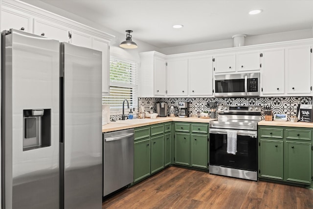 1201 S Rusk St, Weatherford, TX 76086 - kitchen with stainless steel appliances, green cabinets, white cabinets, tasteful backsplash, and recessed lighting