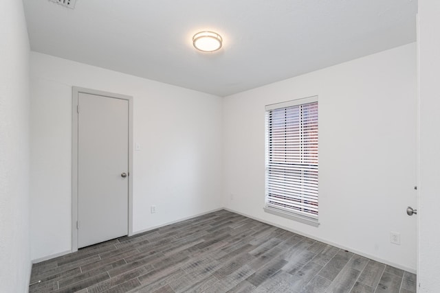 spare room featuring hardwood / wood-style floors