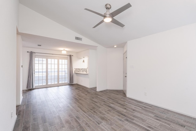 unfurnished living room with hardwood / wood-style flooring, vaulted ceiling, and ceiling fan