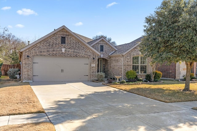 view of front of house with a garage and a front yard