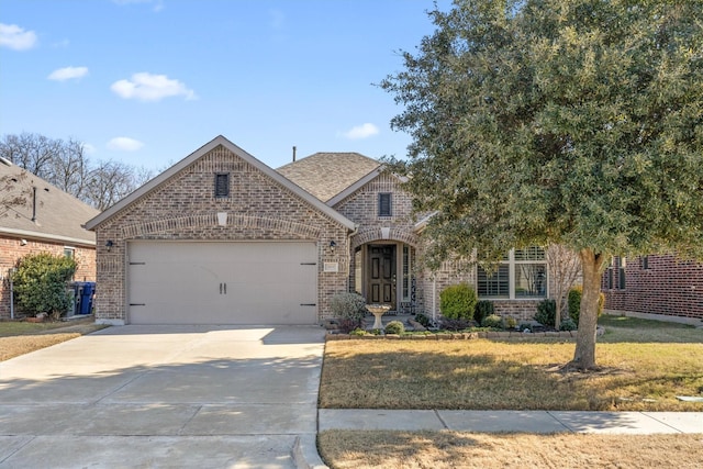 view of front facade featuring a garage and a front lawn