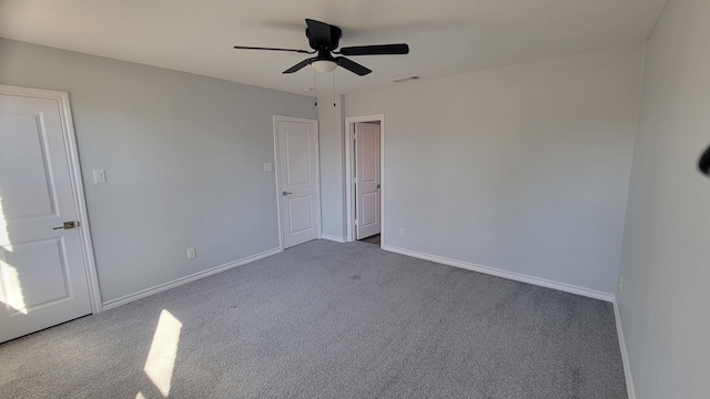 carpeted empty room with ceiling fan