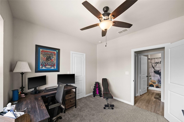 office space with ceiling fan and carpet flooring