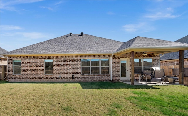 back of property featuring a patio and a yard