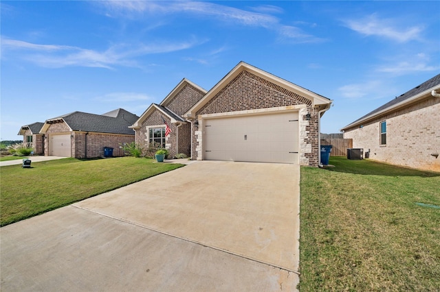 view of front of property featuring a garage, a front lawn, and central AC